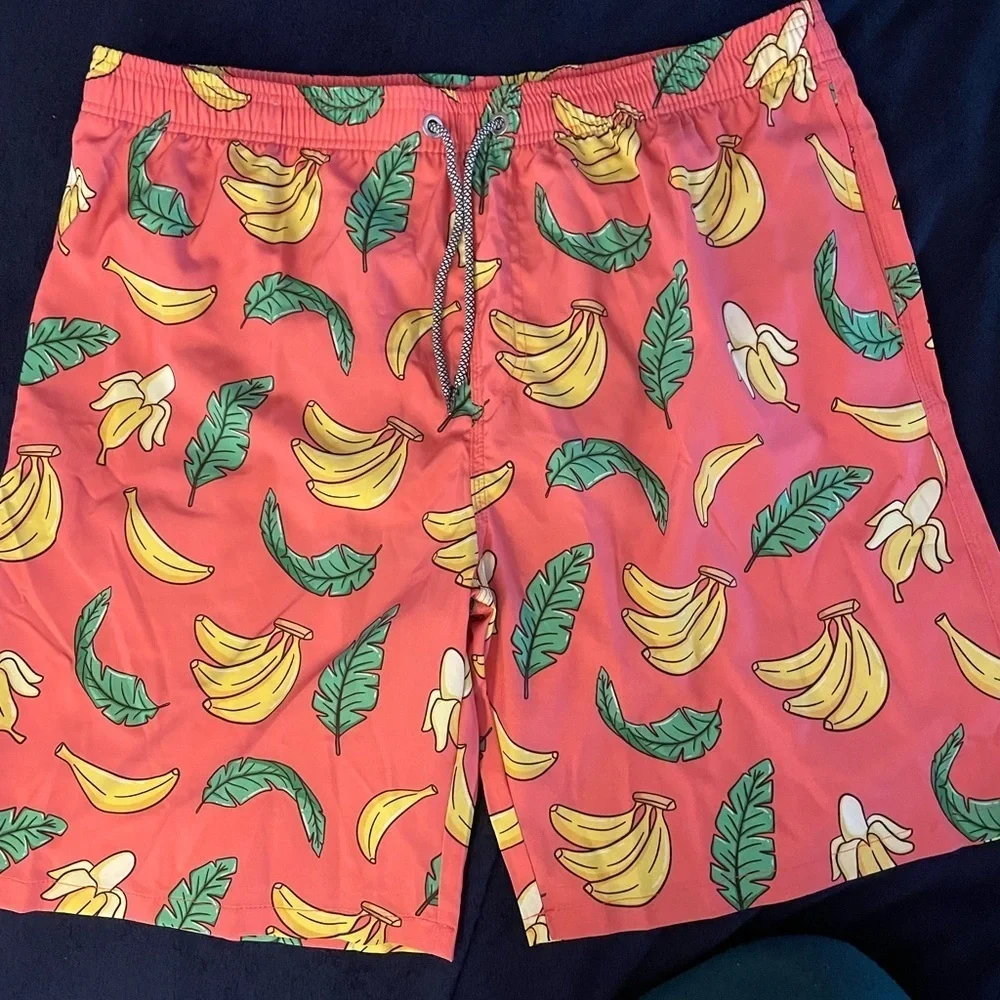 New XXL Men’s Board Shorts Banana pattern.  Built in mash, brief Quick drying